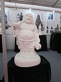 手拿蟠桃和如意的笑面佛玉石雕刻石雕