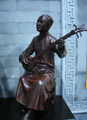 元代弹三弦陶佣