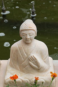 坐姿提掌古代人物石雕像