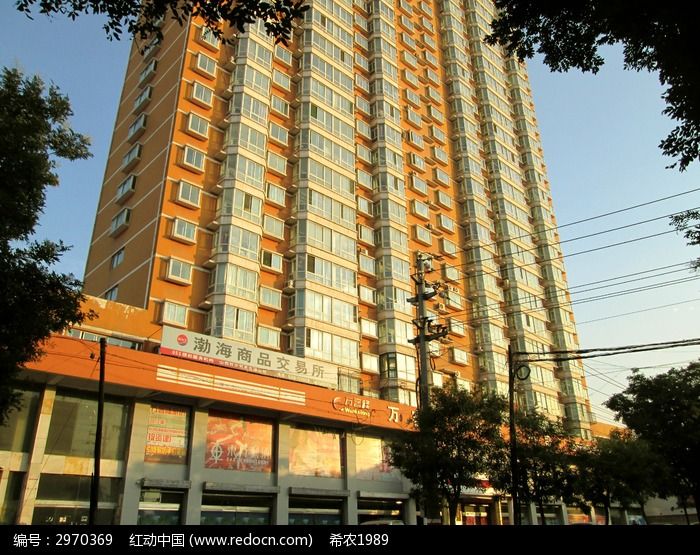 原创摄影图 建筑摄影 城市风光 夕阳下橘黄色的住宅楼 素材描述:红动